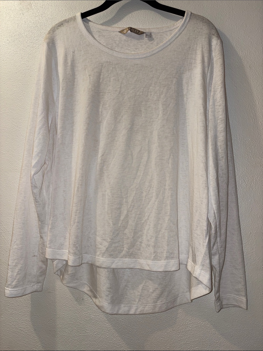 Athleta size XL Soft White Layered Hem Long Sleeve with open back detail